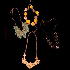 4 costume jewelry necklaces.